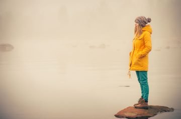 Young-Woman-standing-alone-outdoo